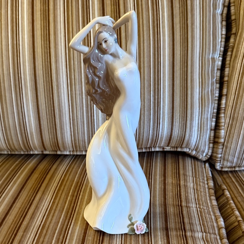 Graceful Cream Sculpture with Floral Accent